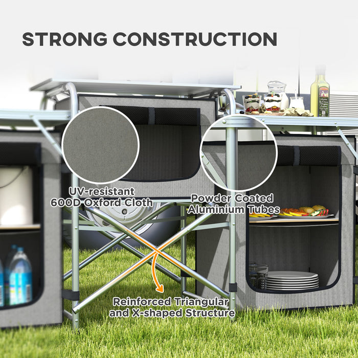 Portable Aluminum Camping Kitchen Station - Foldable Table with 3 Fabric Storage Cupboards, Windshield, Light Holder - Ideal for BBQ, RV Trips, and Outdoor Picnics