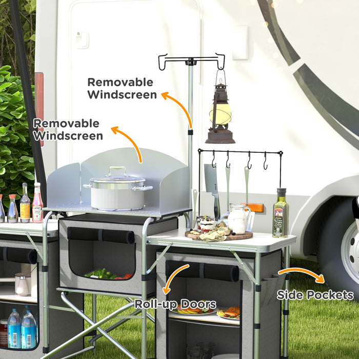 Portable Aluminum Camping Kitchen Station - Foldable Table with 3 Fabric Storage Cupboards, Windshield, Light Holder - Ideal for BBQ, RV Trips, and Outdoor Picnics