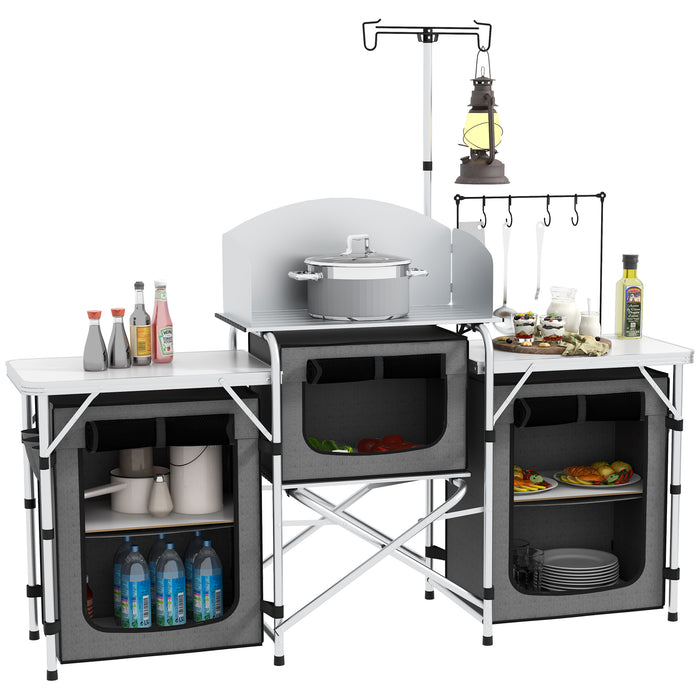 Portable Aluminum Camping Kitchen Station - Foldable Table with 3 Fabric Storage Cupboards, Windshield, Light Holder - Ideal for BBQ, RV Trips, and Outdoor Picnics