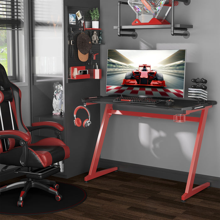 Ergonomic Gaming Desk with Headphone Hook & Cup Holder - Sturdy Home Office Workstation in Black and Red - Perfect for Gamers and Remote Workers, 122x66x86 cm